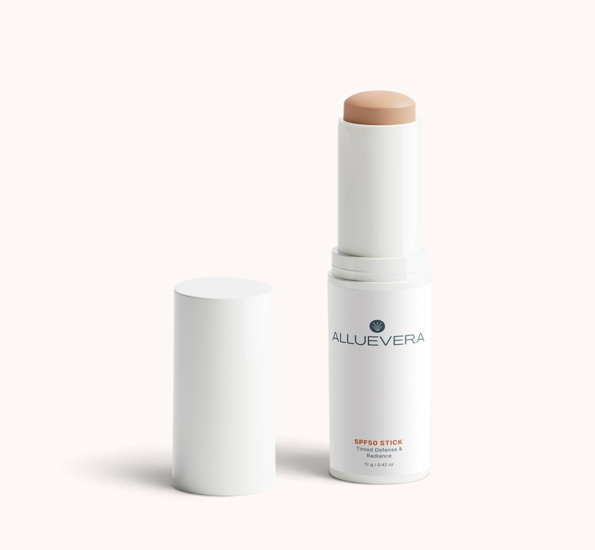 Allurevera Super Stick makeup stick with its cap removed, showing the beige-tan cream product inside a white cylindrical container, set against a solid off-white background.